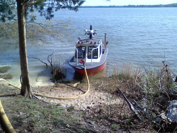 Boat 5 pumping water to a brush fire