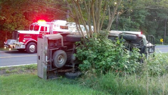 Squad 5 on vehicle on its side